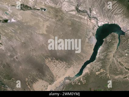 Color satellite image of Longyangxia Dam Reservoir in China’s western province of Qinghai in 1987. This image was taken before the construction of Longyangxia Dam Solar Park north of the reservoir. Stock Photo