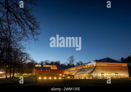 Night shot of exterior of the Burrell Collection Museum and Art Gallery building, within Pollok Park in Glasgow, Scotland, UK Stock Photo