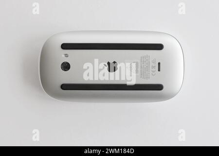 KYIV, UKRAINE - NOVEMBER 27, 2023 Apple Magic Mouse 3rd generation lies on white background close up Stock Photo