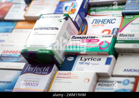 KYIV, UKRAINE - NOVEMBER 27, 2023 Many boxes of pills and capsules stacked in pharmacy drug store close up Stock Photo