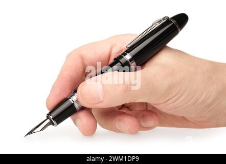 Hand holding classic black fountain pen, writing or drawing, close-up shot, isolated on white background Stock Photo