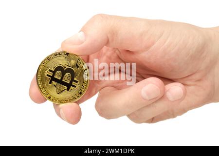 Hand holding bitcoin, close-up shot, isolated on white background Stock Photo
