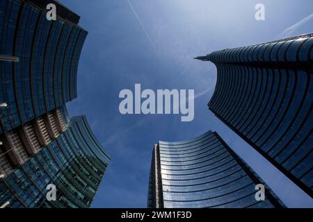 4068145 Milan, Piazza Gae Aulenti, Porta Nuova district. The three Pelli Towers designed by architect Cesar Pelli. From the right: The A Tower (Unicredit Tower), the B Tower and the C Tower; (add.info.: Milan, Piazza Gae Aulenti, Porta Nuova district. The three Pelli Towers designed by architect Cesar Pelli. From the right: The A Tower (Unicredit Tower), the B Tower and the C Tower  Milano, piazza Gae Aulenti, zona Porta Nuova. Le tre Torri Pelli, progettate dall'architetto Cesar Pelli. Da destra: la Torre A (Torre Unicredit), la Torre B e la Torre C); © Marcello Mencarini. All rights reserve Stock Photo