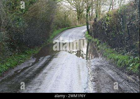 Flooded, muddy, slippery, dirty road in the UK after the heavy rains of February 22nd 2024. Stock Photo