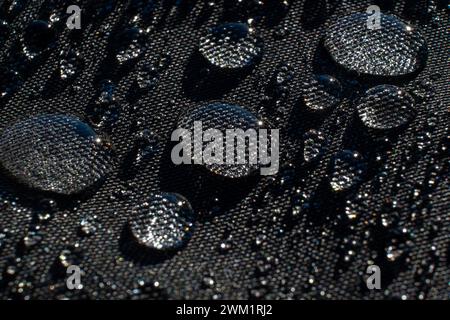 Water Droplets on Waterproof Black Fabric Stock Photo