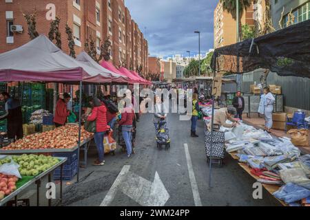 Street stalls with products, sellers and buyers at the weekly open-air Thursday market in the capital city of the Murcia region, Spain, Europe. Stock Photo