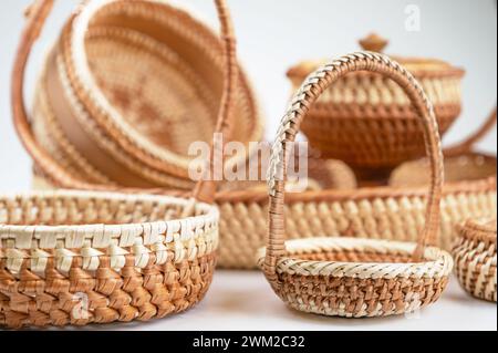Wicker baskets isolated on white background. Basket made of natural materials, close-up Stock Photo