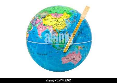 World globe with a thermometer showing Asia and Australia - global warming concept, the temperature increases on earth. Stock Photo