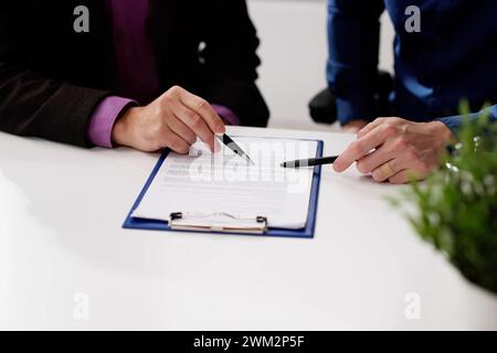 Lawyer Contract Mediation And Review. Two Reading Corporate Document Stock Photo