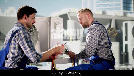 Industrial Air Conditioning Technician. HVAC Cooling System Repair Stock Photo
