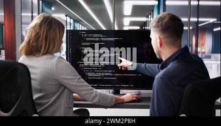 Computer Programmer Using Development Software On Laptop Stock Photo