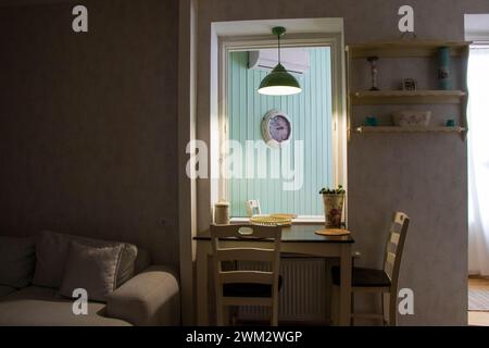 A small dining room overlooking the living area Stock Photo