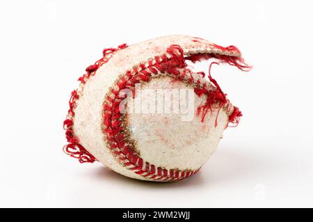 Baseball ball that is ripped and useless on white background Stock Photo