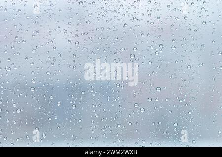 Shot of drops of water on a glass surface Stock Photo