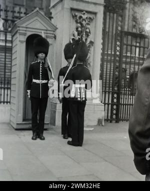 1950s Guardsman on duty outside Buckingham Palace. This image was taken from the original photo. Stock Photo