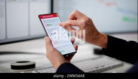 Digital Calendar Schedule Software In Office. Scrum Mobile Phone App Stock Photo