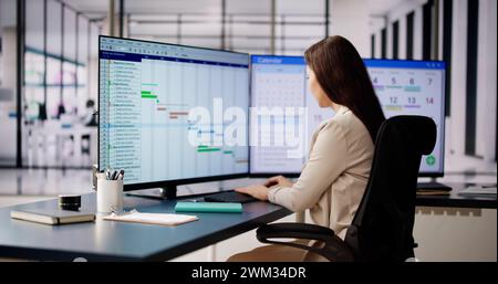 Woman Working On Calendar Agenda Schedule On Computer Stock Photo