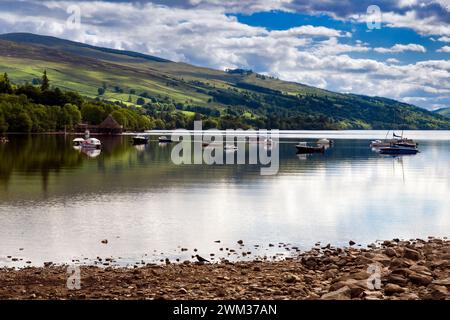 Loch Tay taken from Kenmore with the Crannog centre and boats on Loch Tay, Tayside, Scotland taken in summer at Kenmore Stock Photo