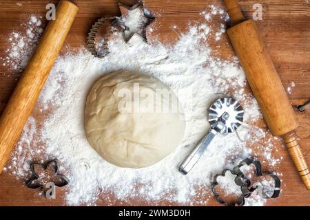 dough on the table with dough tools. forms for squeezing the dough Stock Photo