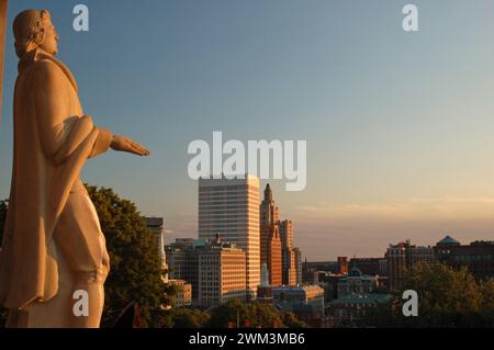 A statue of Roger Smith looks over the skyline of Providence, Rhode Island, the city he founded Stock Photo