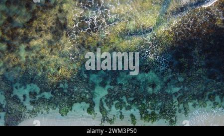 Aerial view of waves rolling towards the shore Stock Photo