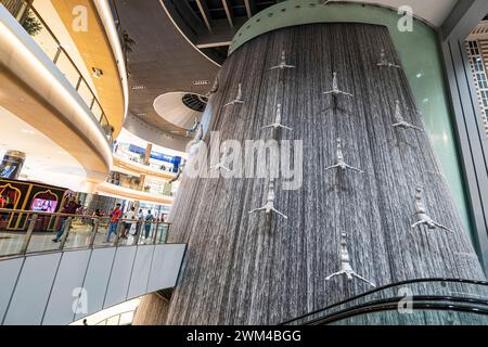 Dubai, UAE , United Arab Emirates. November 28th, 2022: Famous waterfall in Dubai Mall, Flying men. The world's largest shopping mall Stock Photo