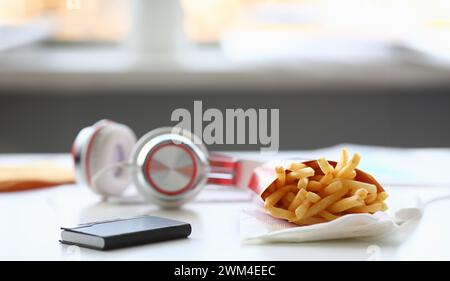 French fries with headphones lying on Stock Photo