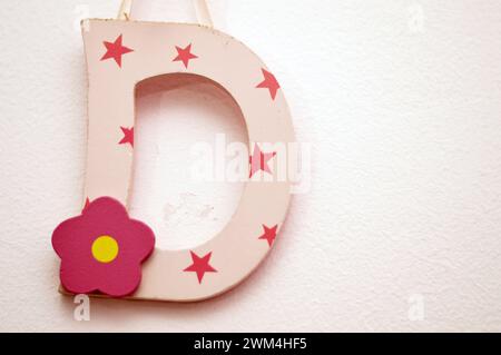 Letter D on the wall, the fourth letter in the Latin alphabet, used in the modern English alphabet, the alphabets of other western European languages Stock Photo