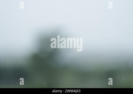 Bokeh defocused background with raindrops falling, backdrop Stock Photo