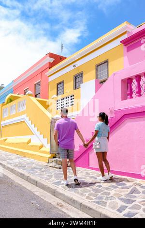 couple walking on the colorful streets of Bo Kaap in Cape Town South Africa, a diverse couple of caucasian men and Asian on a city trip in Cape Town Stock Photo