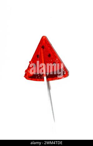 Watermelon flavored lollipop, a type of sugar candy usually consisting of hard candy mounted on a stick and intended for sucking or licking, lolly, su Stock Photo