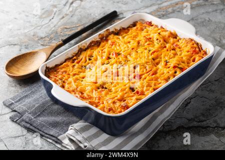 King Ranch Casserole layers of juicy chicken, corn tortillas and cheese enveloped in a cream sauce with tomatoes, bell peppers and green chiles close- Stock Photo