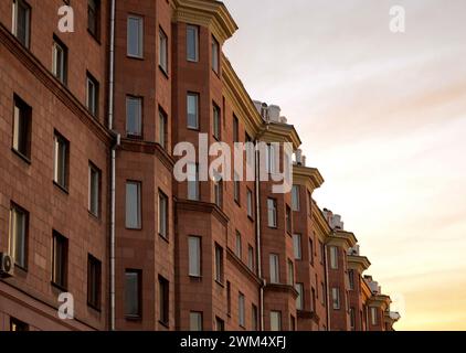 Facade of an old house against the background of the evening sky at sunset Stock Photo