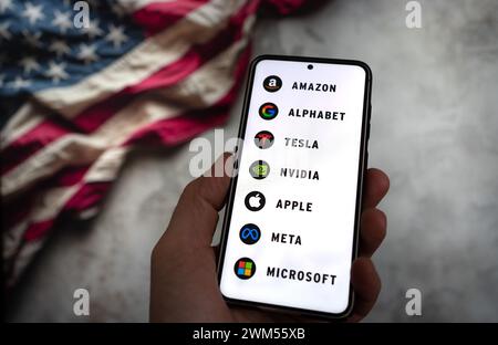 Magnificent Seven - The biggest companies in information technology displayed on smartphone Stock Photo