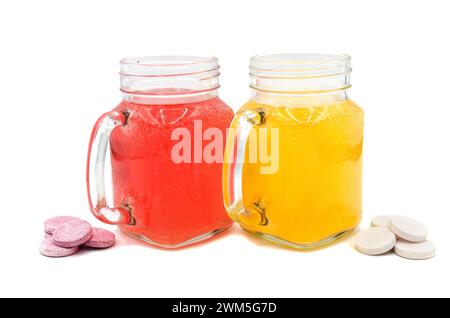 Effervescent tablets in a glass of water close-up on an isolated background. Vitamin C tablet. Health concept. Stock Photo