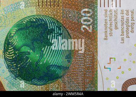 Closeup of 200 Swiss franc banknote and 100 euro banknotes for design ...