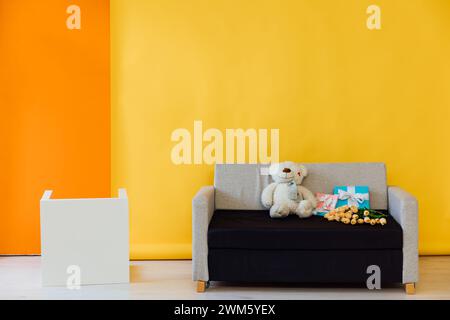 Black and grey office sofa in the interior of a multicolored room Stock Photo