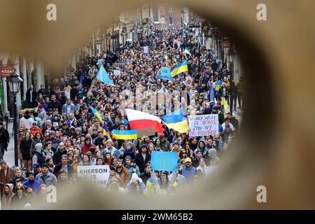 Krakow, Poland, February 24, 2024. Ukrainians and their supporters hold banners, Ukrainian and Polish flags as they attend a march of support and union on the second anniversary of the full scale invasion of the Russian army on Ukraine on Florianska Street in the Old Town of Krakow. The march aims to show the unity of Ukrainian Polish people as well as display support of Russian and Belarus opposition towards Ukrainian struggle. Credit: Dominika Zarzycka/Ģ����ý Live News Stock Photo