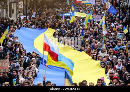 Krakow, Poland, February 24, 2024. Ukrainians and their supporters hold banners, Ukrainian and Polish flags as they attend a march of support and union on the second anniversary of the full scale invasion of the Russian army on Ukraine on Florianska Street in the Old Town of Krakow. The march aims to show the unity of Ukrainian Polish people as well as display support of Russian and Belarus opposition towards Ukrainian struggle. Credit: Dominika Zarzycka/Ģ����ý Live News Stock Photo