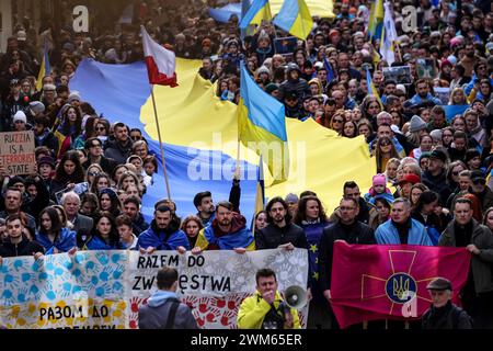 Krakow, Poland, February 24, 2024. Ukrainians and their supporters hold banners, Ukrainian and Polish flags as they attend a march of support and union on the second anniversary of the full scale invasion of the Russian army on Ukraine on Florianska Street in the Old Town of Krakow. The march aims to show the unity of Ukrainian Polish people as well as display support of Russian and Belarus opposition towards Ukrainian struggle. Credit: Dominika Zarzycka/Ģ����ý Live News Stock Photo