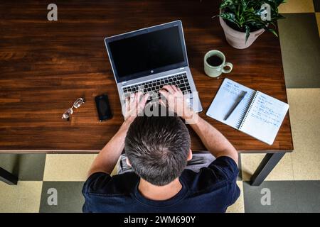 Overhead view of male working from home Stock Photo