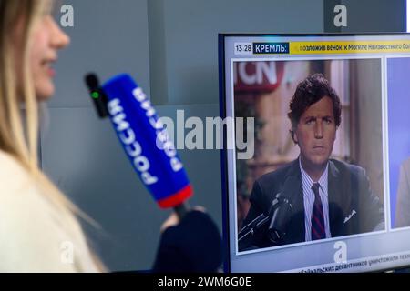 Moscow, Russia. 23rd of February, 2024. Bbroadcast on the information "Russia 24" TV channel of the interview Mike Benz to Tucker Carlson at TV at the exhibition-forum "Russia" at VDNKh in Moscow, Russia Stock Photo