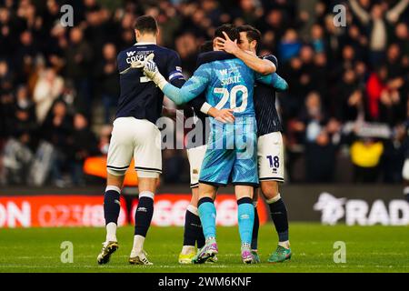 Millwall's Jake Cooper (left) celebrates with Millwall goalkeeper Matija Sarkic (centre) and Ryan Leonard (right) during the Sky Bet Championship match at St Mary's Stadium, Southampton. Picture date: Saturday February 24, 2024. Stock Photo