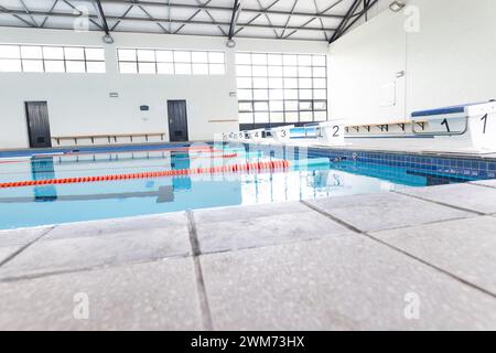 An indoor swimming pool awaits swimmers for training or leisure Stock Photo