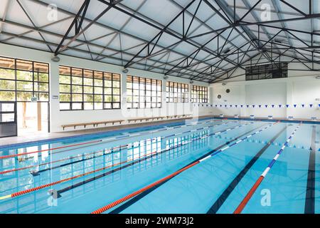 An indoor swimming pool awaits swimmers for training or leisure Stock Photo