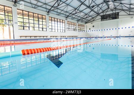 An indoor swimming pool awaits swimmers, with copy space Stock Photo