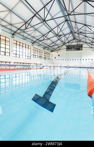 An indoor swimming pool awaits swimmers, with copy space Stock Photo