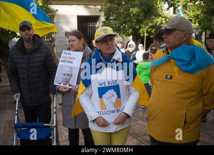 Malaga, Spain. 24th Feb, 2024. Protesters are seen holding placards at Plaza de la Constitucion square as they take part in an anti-war protest between Ukraine and Russia. Marking the second anniversary of the Russian invasion of Ukraine, hundreds of people have gathered at Plaza de la Constitucion square in solidarity with Ukraine people, against the war and calling for peace. Credit: SOPA Images Limited/Alamy Live News Stock Photo