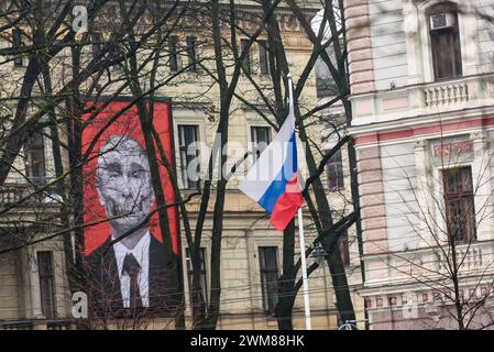 RIGA, LATVIA. 24th February 2024. Selective focus photo. Huge banner with artwork - skull of Russian president Vladimir Putin in front of Embassy of Russia in Latvia. 2 years since Russia started brutal war against Ukraine. Stock Photo