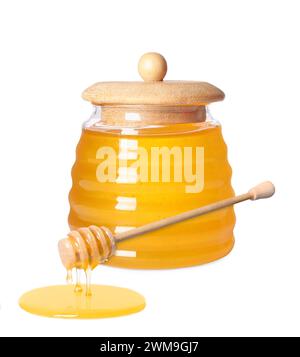 Natural honey dripping from dipper. Jar full of honey on white background Stock Photo